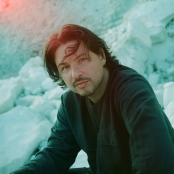 Musician Jamie Moon sitting outside